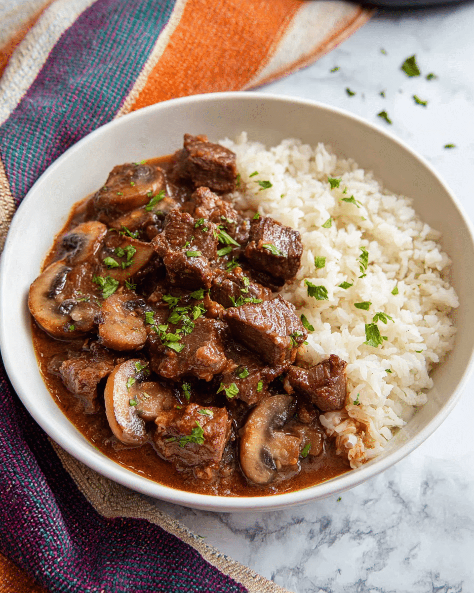 This image shows a close-up of a black slow cooker filled with a thick stew containing several chunks of browned beef and sliced mushrooms covered in a rich brown sauce, garnished with small green herb pieces scattered on top. A silver ladle inside the cooker holds a scoop of the beef and mushroom stew, highlighting the glistening texture of the meat and mushrooms in the sauce. The slow cooker is placed on a white marbled surface. photo taken with an iphone --ar 4:5 --v 7