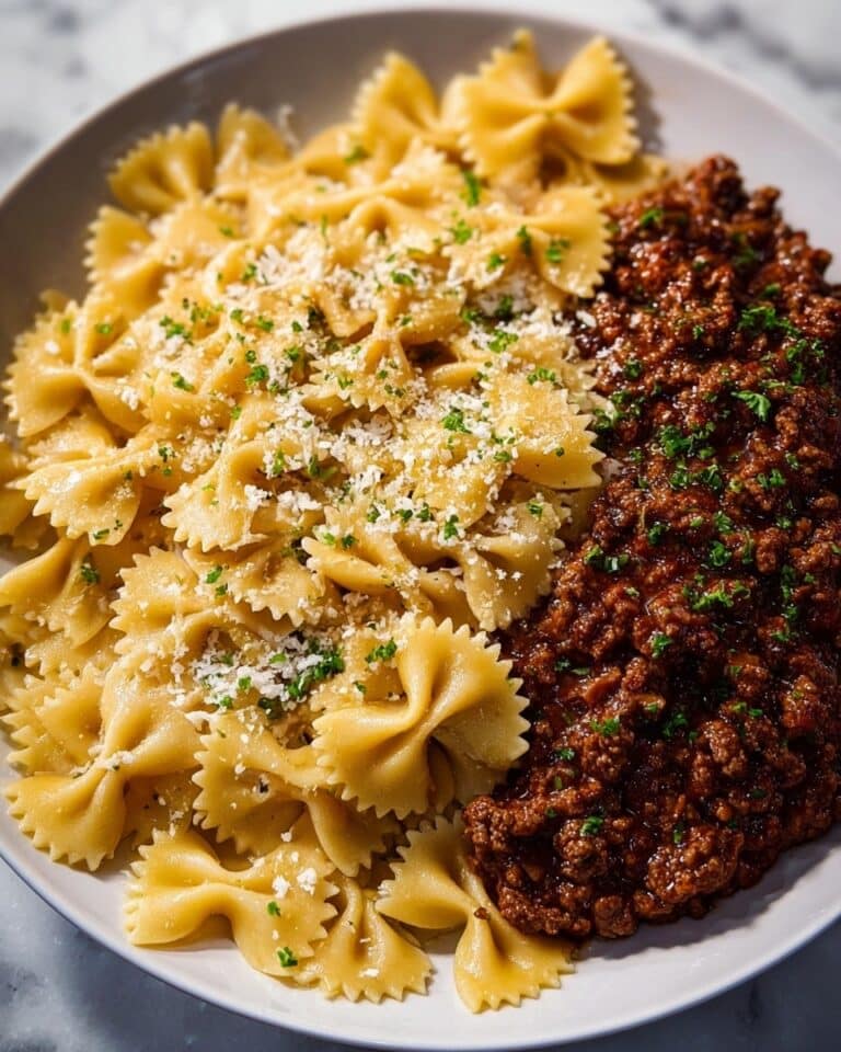 Cheesy Bowtie Pasta with Savory Cajun Ground Beef in Garlic Cream Recipe