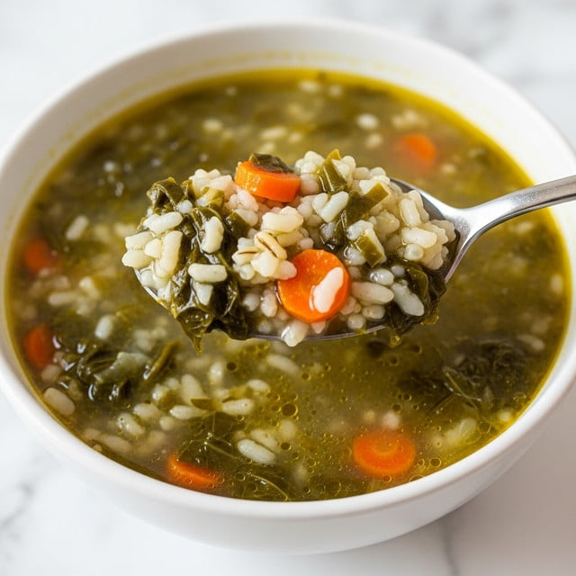 A close-up top view of a white enameled pot with blue handles filled with soup, showing a mix of small chopped vegetables like orange carrots, green leafy bits, and translucent onions suspended in a clear brownish broth, with a shiny silver spoon holding a scoop of the chunky soup above the pot, all held by a woman's hand with a bracelet, set against a white marbled texture. photo taken with an iphone --ar 4:5 --v 7